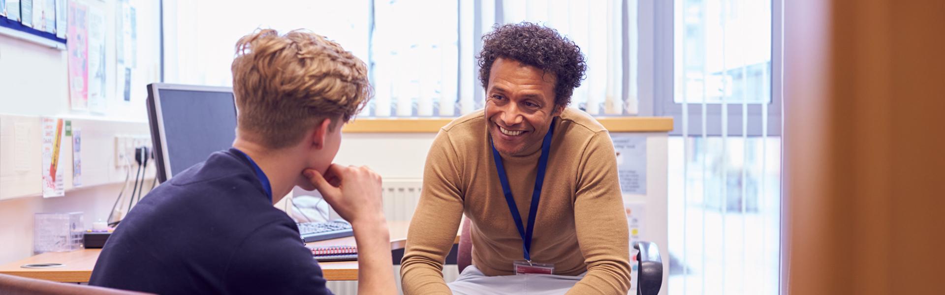 teacher and pupil in office