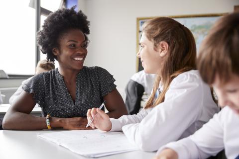 Teacher talking to pupil
